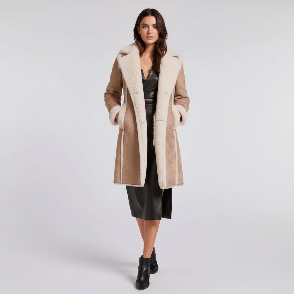 Woman wearing a beige coat with white fur trim on a white background