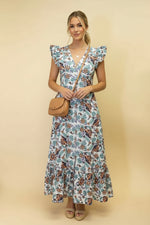 Woman wearing a floral dress against a beige background