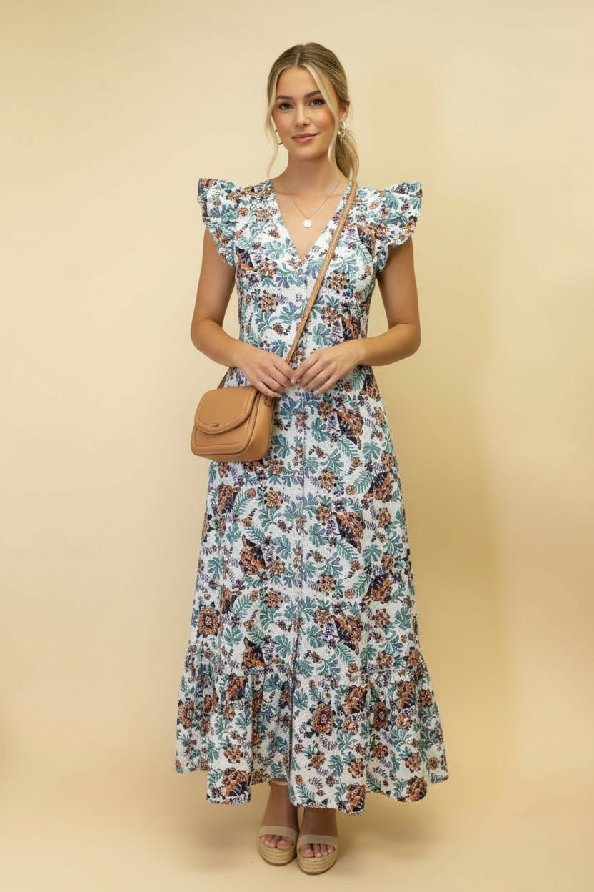 Woman wearing a floral dress against a beige background