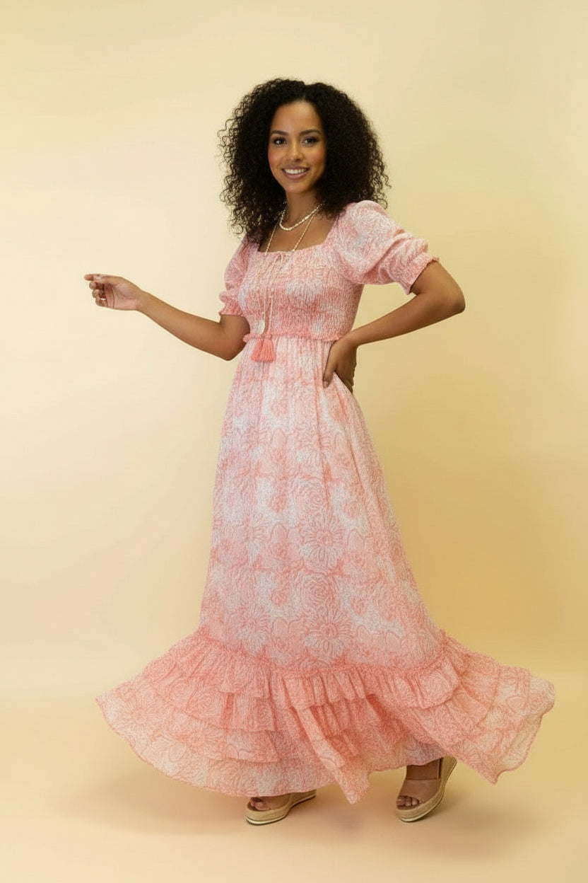 Woman wearing a pink floral dress on a beige background