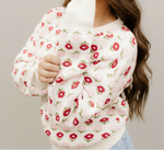 Floral patterned sweater with a close-up of the fabric texture.